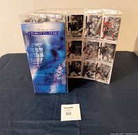 Photo shows the blue Toronto Star branded folding display containing numerous hockey cards held in plastic sheets, still sealed and new.