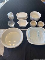 Overview of all bakeware including casserole dish, small serving dishes, ceramic bowls, pie plates, and ramekins.