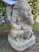 Front angled view of the cement Ganesha elephant garden statue showing detailed carvings and texture.