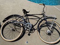 Full left side view of bicycle showing frame, wheels, fenders, handlebars and rack