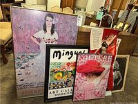 Seven pieces of wall art displayed together including prints and posters, showing a range of styles and colors with sizes approximately 16x21 to 25x39 inches.