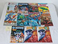 Full view of all 11 comic books arranged in two rows, showing titles and cover artwork.