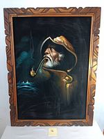 Full view of vintage painting showing sea captain or fisherman with pipe in carved wooden frame.