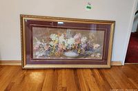 Full view of the framed floral print showing the entire artwork and frame.