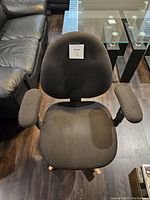 Top view of the seat and backrest showing fabric texture and armrests