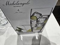 Michelangelo 20oz glass box with product image and brand details.