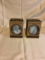 Two boxes containing stainless steel wine tumblers, triple insulated and vacuum sealed, new in box.