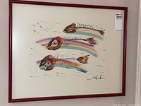Front view of abstract fish artwork showing three rainbow-colored skeleton fish with detailed eyes in a red wood frame.