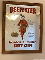 Front view of the Beefeater Gin mirror showing full framed artwork and text