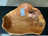 Top view of the large burled wood bowl showing the natural grain, knots, and irregular shape.