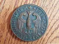 Close-up of the bronze seal showing an eagle with Latin inscription around the edge.