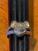 Front view of vintage sterling silver Mickey Mouse ring showing detailed face design on band sized 9.