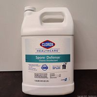 Front view of 1 gallon Clorox Healthcare Spore Defense Cleaner Disinfectant container showing label and branding.