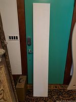Full front view of the rectangular blank canvas panel showing the white canvas surface.