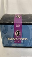 Box of the Star Trek Collectibles Reunion Diorama showing brand and series logo with visible wear on the corners