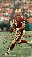 Close-up photo of signed 8x10 color photograph depicting J. Garcia in San Francisco 49ers uniform mid-play. Signature visible in black ink across image.