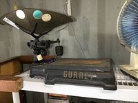 Overall profile view of the scale setup on a shelf showing full length and structure