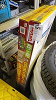 Box showing 45x45 inch metal ceiling storage unit dimensions and HyLoft branding.