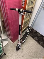 Full view of the Gotrax electric scooter showing the handlebar, stem, and front wheel.