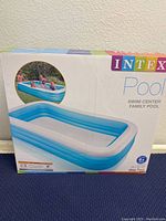 Box front showing product image with children playing in the pool
