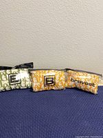 Three pairs of Bravest Studios shorts, each in different color patterns, laid out side by side showing exterior design and branding.