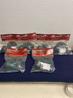 Photo showing the lot of 6 Ace Hardware branded Portable Floodlight Kits, all new in sealed packaging with red header cards.