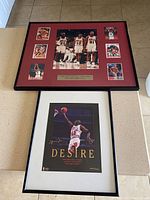 Top-down photo showing framed Bulls card collage with multiple cards and framed Michael Jordan 'Desire' limited edition print beneath it.