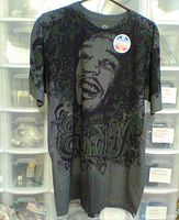 Front view of navy blue Jimi Hendrix T-shirt with large graphic print of Jimi Hendrix's face and stylized 'Hendrix' text.