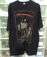 Front view of a black Led Zeppelin t-shirt showing the band members and tour details in vintage style print.