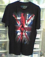 Front view of black The Who t-shirt showing full graphic design of Union Jack, band member, and text.