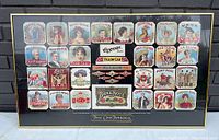 Full view of the framed antique tobacco label collection poster with bright colorful detailed vintage labels arranged in rows.
