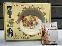 Photo of one Royal Doulton Bunnykins children's dish set with bowl, spoon, and booklet in original box.