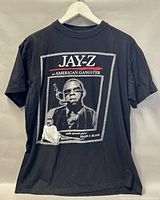 Front view of black T-shirt with JAY-Z and Mary J. Blige tour graphics.
