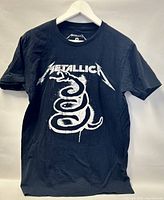 Front view of black Metallica T-shirt with white logo and serpent graphic.