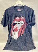 Front view of dark heather grey Rolling Stones T-shirt showing tongue logo with Canadian flag graphic.