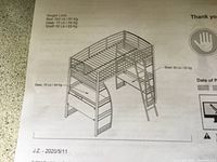 Photo of bed assembly instructions showing weight limits and bed design.