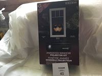 Front view of the box showing the product name, brand Window FX, and an example window projection with a pumpkin.