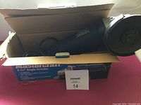 Mastercraft 4-1/2 inch angle grinder inside original box showing tool and power cord