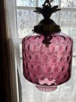 Close-up of purple textured glass shade with bubble design