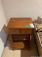 Full front view of the Kroehler night stand showing drawer, shelves, and base design.