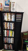 Media racks holding DVD movies, VHS tapes, and CDs, showing the organization of item cases.