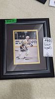 Full view of the framed signed photo of Mario Lemieux, showing overall size and framing.