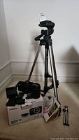 Giotto VT-806 tripod collapsed with grouped camera kit on floor