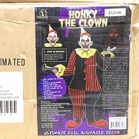 Image of original packaging showing Honky the Clown animatronic figure in red and black striped outfit. Box features product details and warnings.