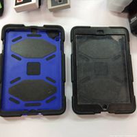 Two rugged tablet cases, one blue and black, the other black