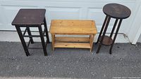 Overview of 3 wooden plant stands showing different colors and styles, with visible surface wear