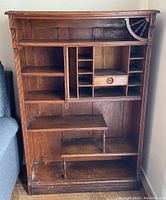 Front view showing overall design, shelves, pigeonholes and drawer