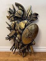 Full front view of the knight wall hanging showing its size, shape, and detailing