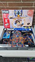 Full view of both K'NEX boxes stacked, showing product names and Thrill Rides branding.