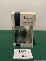 Fragrance atomizer bottle in original packaging displaying front and product branding.